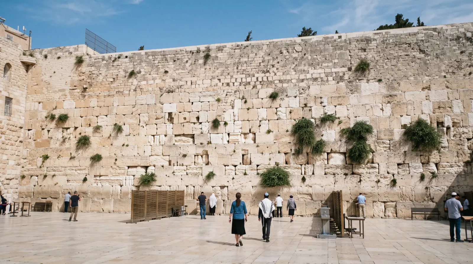 The Western Wall in Jerusalem at 10:00 under a clear blue sky, western wall